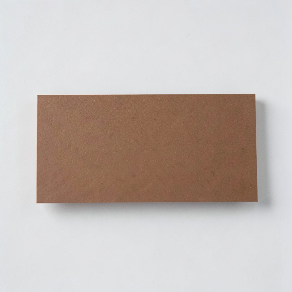 A minimalist brown-toned business card on a clean light surface, warm and understated